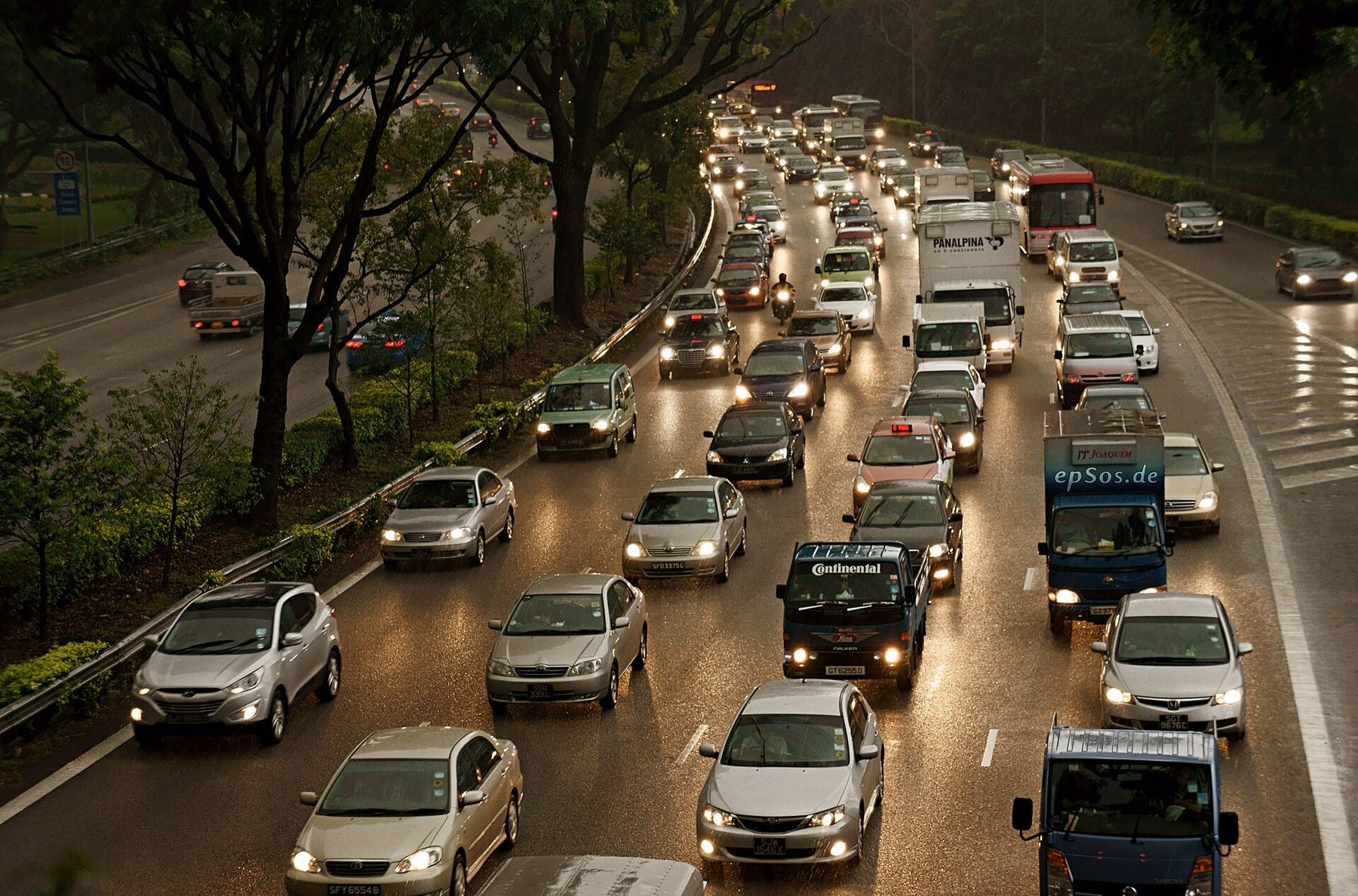 Rows of cars in heavy traffic at dusk