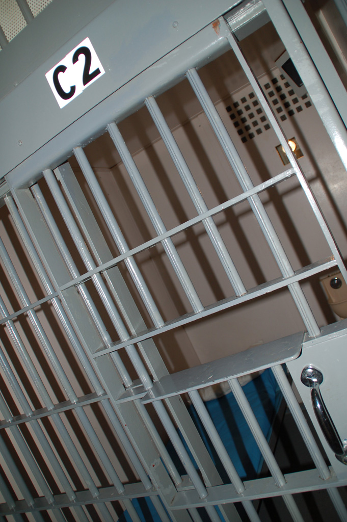 A jail cell door with steel bars, labeled C2