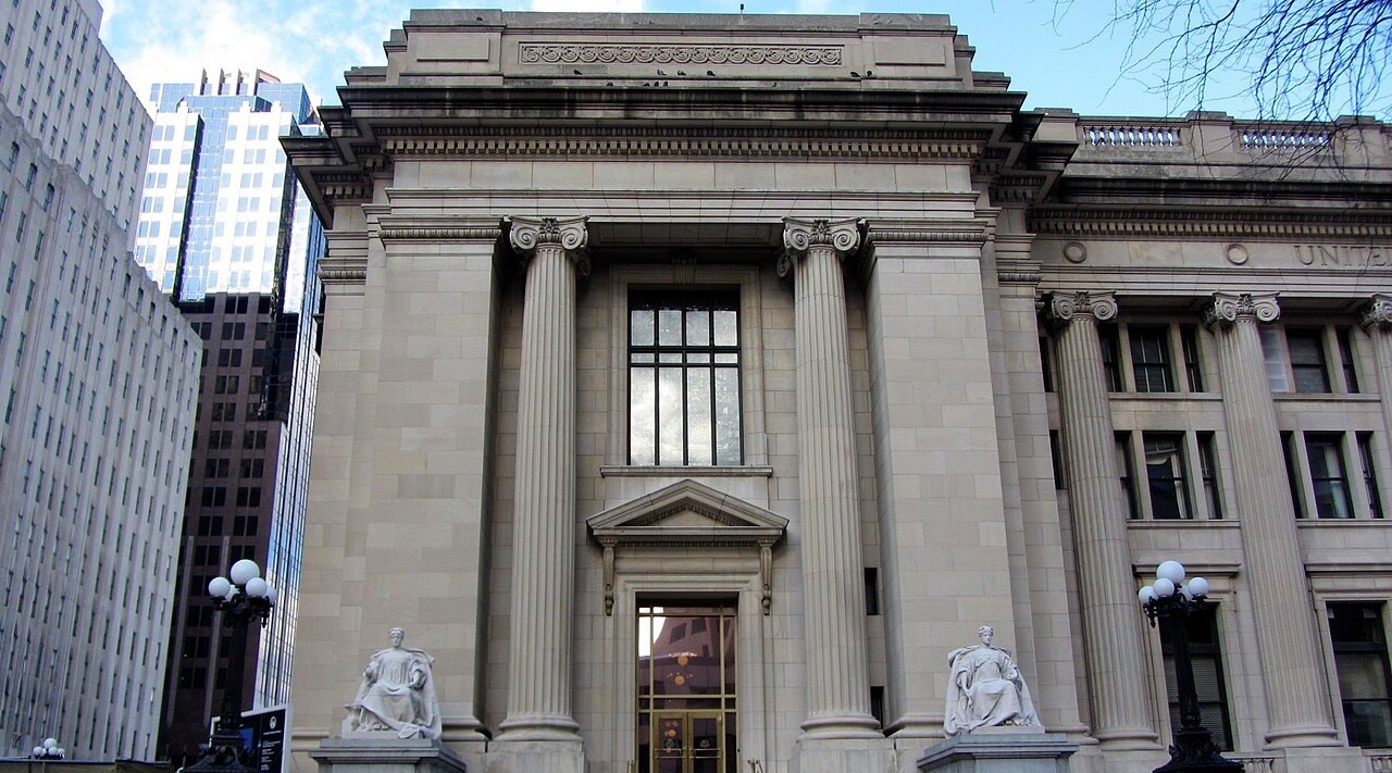 The stone facade and columned entrance of a U.S. federal courthouse